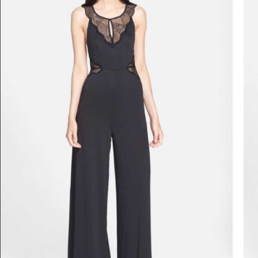 Black Filtre lace inset jumpsuit. Size small.